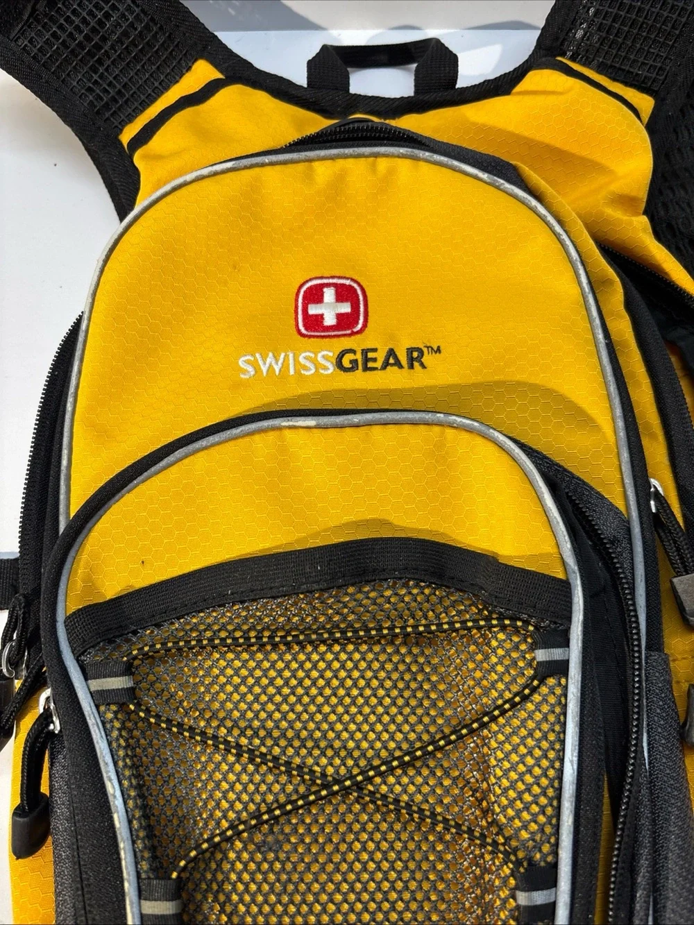 SwissGear unisex Yellow and Black Compact Daypack Backpack.